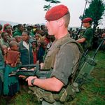 Two French soldiers stand guard at the Nyarushishi Tutsis refugees’ camp on April 30, 1994. 