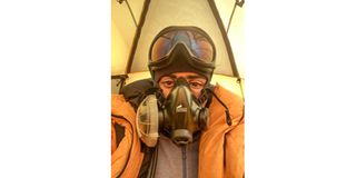 Rawan Dakik takes an oxygen break on the Mount Everest expedition.