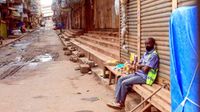 A lone trader with his merchandise