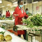 Workers prepare flowers for export. 