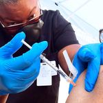 A nurse administers the Pfizer Covid-19 vaccine at a mobile vaccine clinic