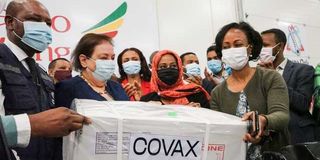 Ethiopia’s Health Minister Lia Tadesse receives a box of AstraZeneca Covid-19 vaccines,