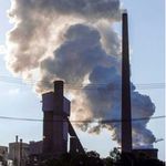A factory emits smoke