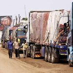 Goods trucks await clearance at the Uganda-Tanzania border