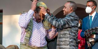 Kenya's President Uhuru Kenyatta and Somalia's Prime Minister Mohamed Hussein Roble.