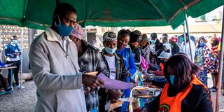 Zambians queue at a polling station in the capital Lusaka 