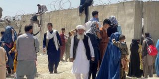 People flee Afghanistan.