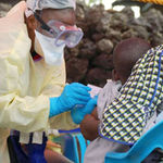 A child receives a vaccine against Ebola 