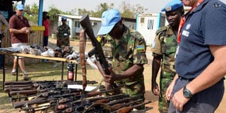 UN commanders in South Sudan inspect confiscated guns in 2014.