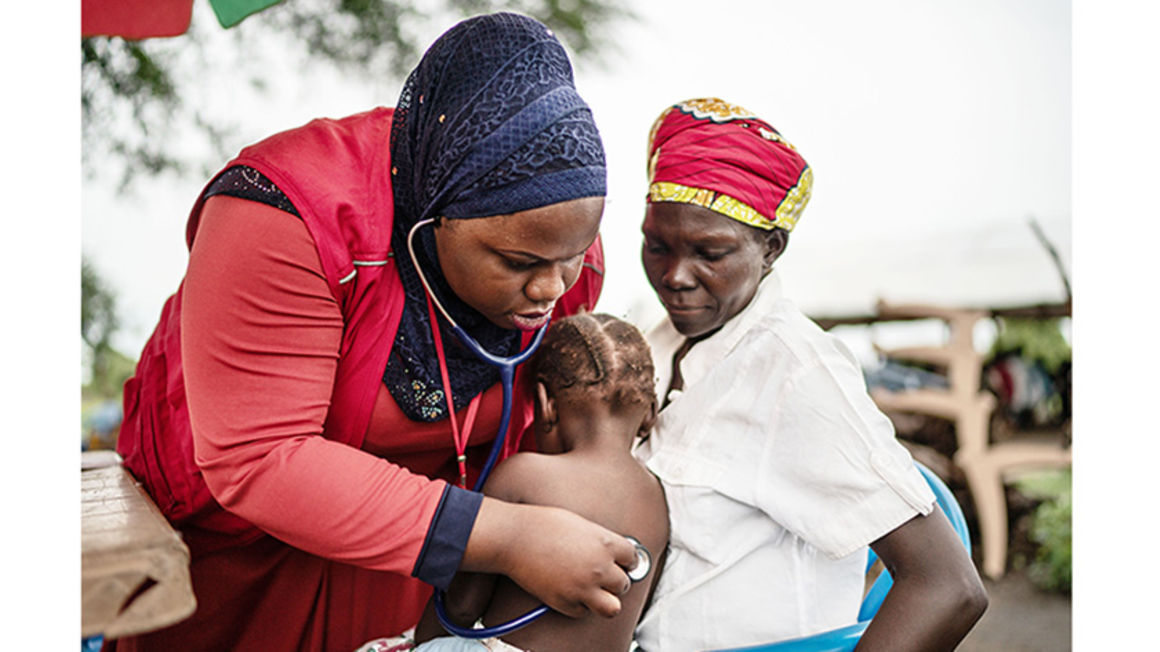 Celina's daughter, Rose, gets checked for malaria at Save the Children's mobile clinic in Uganda.