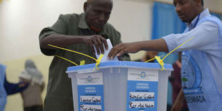 A man votes in a past election in Somalia.
