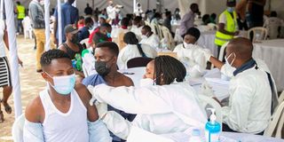 Health workers administer Covid-19 vaccines in Rwanda.