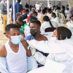 Health workers administer Covid-19 vaccines in Rwanda.