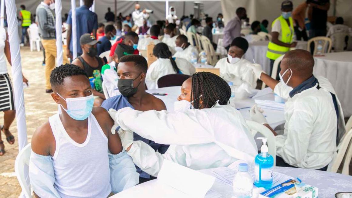 Medical officials administer Covid-19 vaccines in Rwanda.