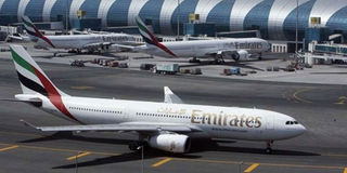 An Emirates Airlines plane taxis on the tarmac at the Dubai International Airport.