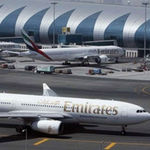 An Emirates Airlines plane taxis on the tarmac at the Dubai International Airport.