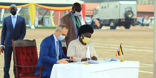 TotalEnergies General Manager Philippe Groueix and Uganda's Energy Minister Ruth Nankabirwa.