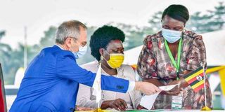 TotalEnergies Uganda General Manager Philippe Groueix and Uganda's Energy Minister Ruth Nankabirwa.