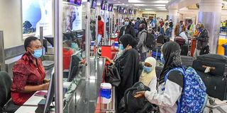 Passengers check in at Jomo Kenyatta International Airport, Nairobi.