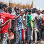 Tigrayans queue for food aid in 2021 at a camp for displaced people.