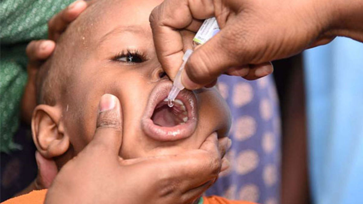 A child receives polio vaccine.