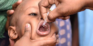 A child receives polio vaccine.