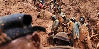 Men work in a gold mine in DR Congo.