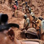 Men work in a gold mine in DR Congo.