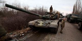 Ukrainian servicemen get ready to repel an attack in Ukraine's Lugansk region on February 24, 2022.