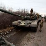 Ukrainian servicemen get ready to repel an attack in Ukraine's Lugansk region on February 24, 2022.