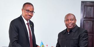 Burundi President Evariste Ndayishimiye (right) with Rwanda’s Minister of Defence Gen Maj Albert Murasira.