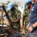 UN commanders in South Sudan inspect confiscated guns in 2014.
