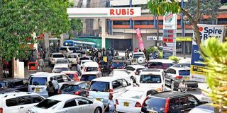 Motorists queue for fuel.