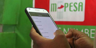 A client using mobile money service M-Pesa. 