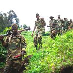 M23 rebels withdraw through the hills from Karuba in eastern Democratic Republic of Congo in 2012