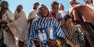 Women mourn victims of a massacre allegedly perpetrated in Tigray in February 2022.