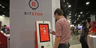 A man buys bitcoins at a Bitstop ATM in Miami.