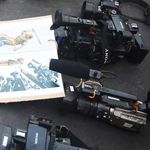 Journalists' cameras.