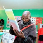 A man prepares to cast his ballots on August 9, 2022