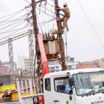 Umeme technicians at work in Kampala. 