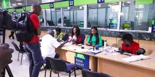 Clients inside a KCB bank branch.