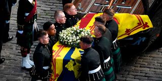 Pallbearers carry the coffin of Queen Elizabeth II.