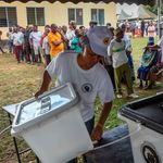 Tanzania election official prepares ballot boxes for voting 
