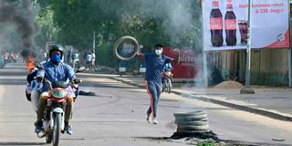 Demonstrators burn tyres during clashes with Chadian police in N'Djamena