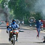 Demonstrators burn tyres during clashes with Chadian police in N'Djamena