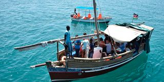 Tourists on a boat at Kenya's coast.