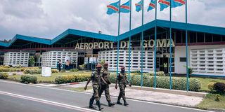 Soldiers walk at Goma Airport in eastern DRC