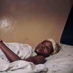Twizire Bukomeye lies on a hospital bed in DR Congo