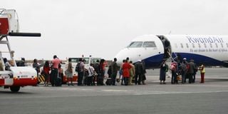 Travellers boarding Rwanda Air plane at JKIA, Nairobi. 