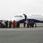 Travellers boarding Rwanda Air plane at JKIA, Nairobi. 